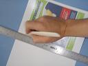 Creasing the cover with the Bone Folder and Straight Edge